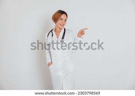 female doctor with phonendoscope stethoscope in hospital shows direction