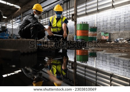 Scientists and government officials Inspect and collect chemical leak samples in industrial sites. to be thoroughly investigated in the laboratory Royalty-Free Stock Photo #2303810069