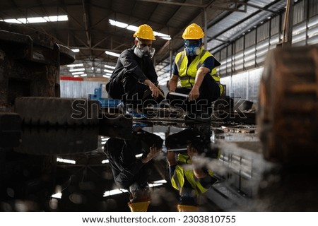 Scientists and government officials Inspect and collect chemical leak samples in industrial sites. to be thoroughly investigated in the laboratory Royalty-Free Stock Photo #2303810755