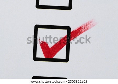Red pen marking on checklist sheet