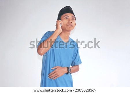 Asian Young Man On The Phone