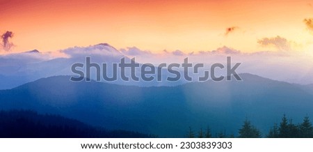 A majestic view of the mountain ranges illuminated by the sunset. Location place Carpathian mountains, Ukraine, Europe. Photo wallpaper. Image of a natural background. Discover the beauty of earth.