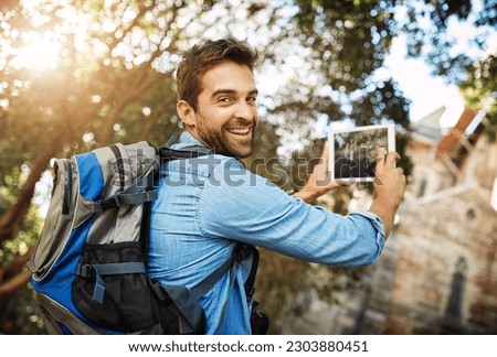 Man, tourist and tablet for travel photo outdoor in nature with a backpack and smile. Portrait of male person with tech for hiking adventure, journey or vacation photography and freedom or happiness