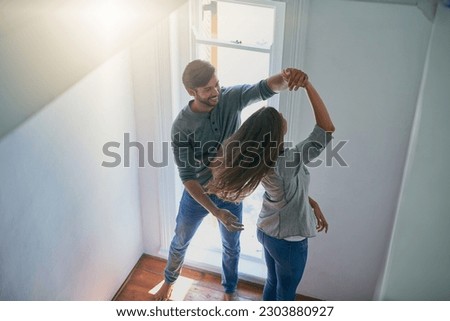 Love, couple and dance in home, top view and having fun together for romance. Dancing, happy and man and woman, bonding and affection, freedom and enjoying quality time on anniversary mockup in house Royalty-Free Stock Photo #2303880927