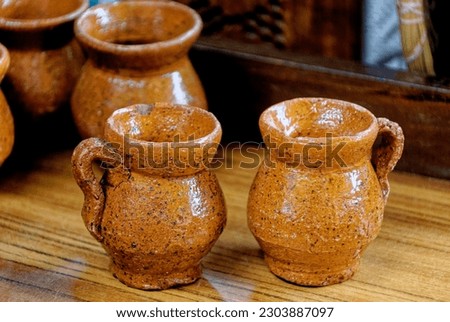 Typical guatemalan handmade pottery mugs souvenirs. Antigua - Guatemala. 24th of March 2011 Royalty-Free Stock Photo #2303887097