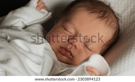 Beautiful caucasian newborn baby Child sleeping in bed. Little kids concept. Close-up portrait Royalty-Free Stock Photo #2303894123