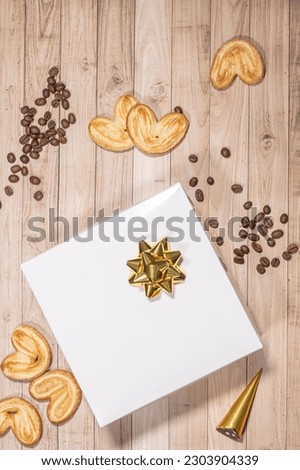 White box mockup between different sweets on the table and figures