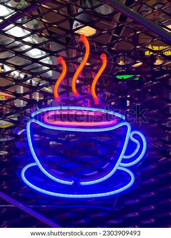 Illuminated hot coffee.Bright colored collection of symbols or sign boards glowing with colorful neon light for cafe, restaurant, motel, cocktail bar. Template layout on grid background, copy space.