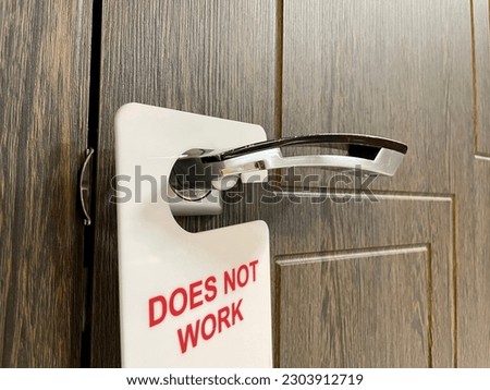 The sign on the door does not work. Sign on the door