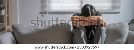 Mental health problem, Sad asian Male anxiety depressed lonely in his home.
 Royalty-Free Stock Photo #2303929597
