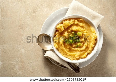 Root mash. Root vegetables mashed in a bowl. Garnished with oil and herbs. Royalty-Free Stock Photo #2303932019