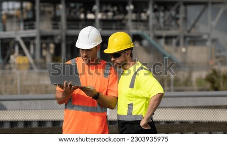 concentrated supervisor men have construction project on laptop. photo of supervisor men