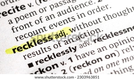 Close up photo of the word reckless Royalty-Free Stock Photo #2303963851