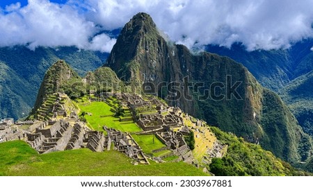 View over Machu Picchu, a 15th-century Inca citadel located in the Peru, South America. One of the Seven Modern Wonders of the World Royalty-Free Stock Photo #2303967881