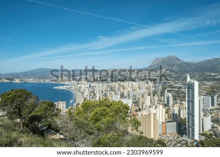 Panorama of famous Benidorm resort city from Serra Gelada Natural Park. Coast of Mediterranean sea, Benidorm skyscrapers, hotels and mountains in the background. Alicante province, Spain