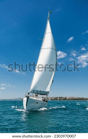Sailing yacht on blue sea. Royalty-Free Stock Photo #2303970007