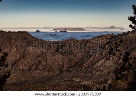 Cloud Inversion in the Valley Below the South Rim Overlook in Big Bend National Park Royalty-Free Stock Photo #2303971309