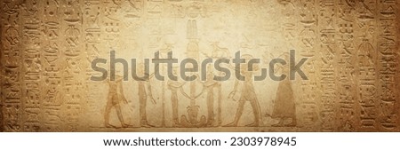 Gods of ancient egypt and old Egyptian hieroglyphs on ancient background. Wide historical background. Ancient Egyptian hieroglyphs as a symbol of the history of the Earth. 