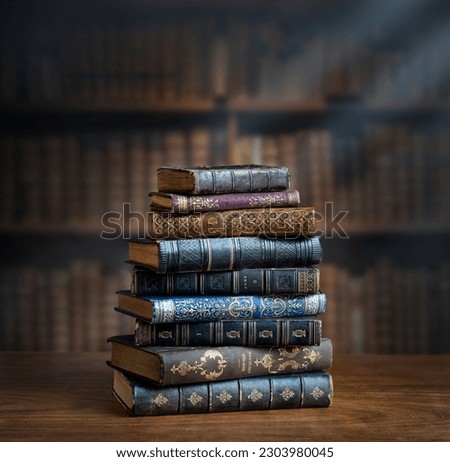 Stacks of old books on wooden desk in old library. Ancient books historical background. Retro style. Conceptual background on history, education, literature topics. Royalty-Free Stock Photo #2303980045