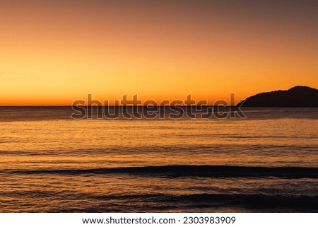 Vibrant sunrise over the water at Jimmy's Beach in Hawks Nest NSW Australia