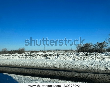 snowy landscape of Ireland pictured in a moving car