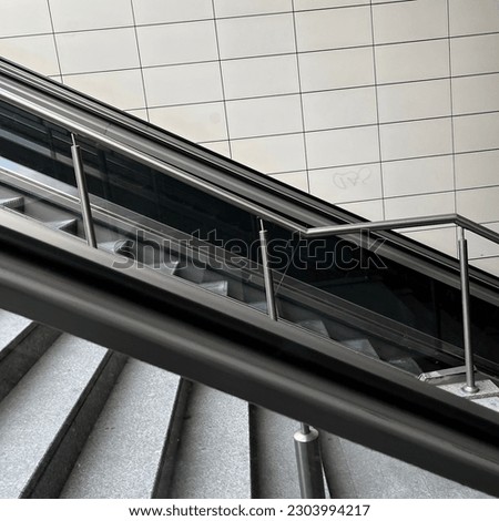 Gray scale transportation, train stairs with diagonal frame