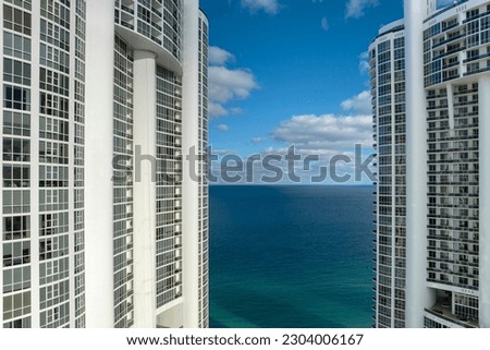 View from above of luxurious highrise hotels and condos on Atlantic ocean shore in Sunny Isles Beach city. American tourism infrastructure in southern Florida Royalty-Free Stock Photo #2304006167