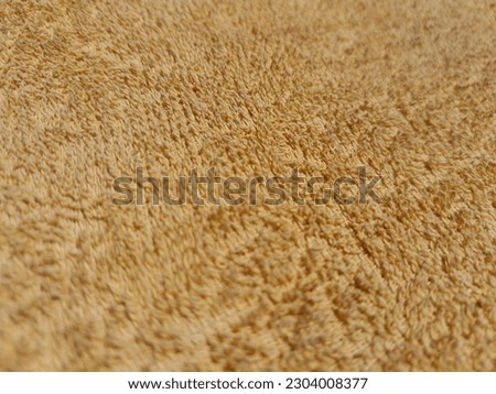 a pictures of textured yellow cloth for background