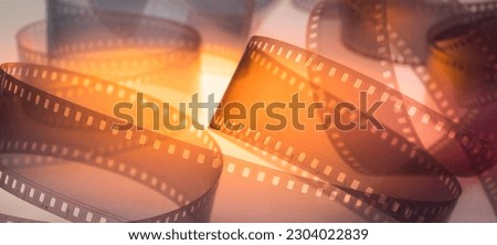 multicolored abstract background with film strip.film festival filmmaking movie announcement concept Royalty-Free Stock Photo #2304022839