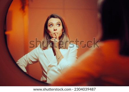 
Businesswoman Looking in the Mirror Wondering and Planning. Woman having self-doubt mixed feelings about her ideas 
 Royalty-Free Stock Photo #2304039487
