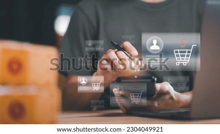 Startup or small business entrepreneur ,Make a note of delivery address from customer ,order management in online stores, shopping on the internet ,Selling online on the Internet ,SME ,e-commerce Royalty-Free Stock Photo #2304049921