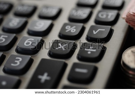 Money and calculator in saving growing money concept.