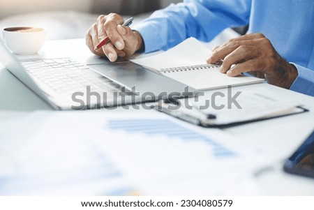 Asian businessman using laptop at desk for online document, writing email and business proposal. Technology, networking on computer for research for investment or start new business
