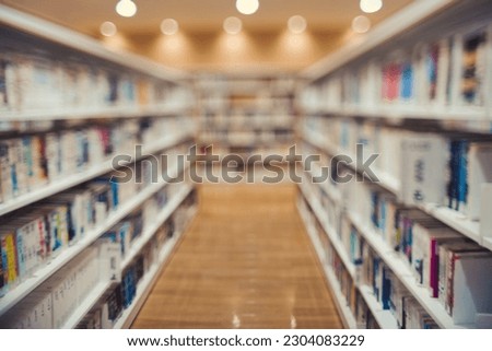 Blur of bookshelf and library image Royalty-Free Stock Photo #2304083229