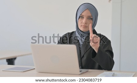 No, Rejecting Muslim Businesswoman Waving Finger at Work