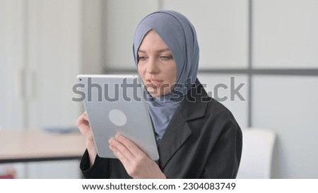 Portrait of Muslim Businesswoman Doing Video Chat on Tablet