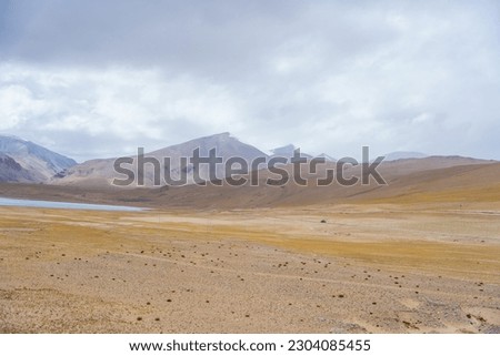 Desert landscape, clouds flying over the mountain