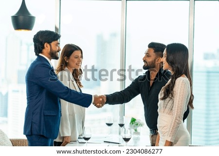 Group of Business people teamwork partnership handshake during success with corporate financial business agreement at office meeting room. Executive manager successful signing business contract deal.