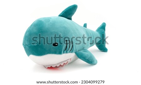 Plush shark doll isolated on white background. High quality photo