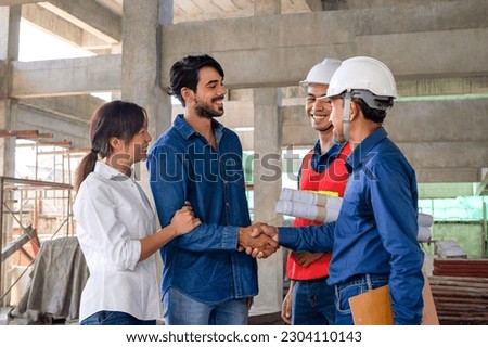 the new homeowners family, husband and wife meet contractor to inspect the progress of building a house at a building under construction, concept of real estate business, building a new house