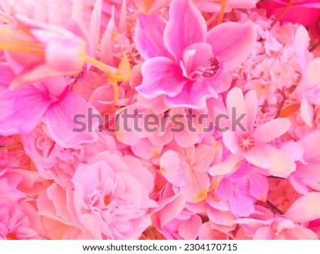Artificial pink flowers bouquet for valentines or wedding day background. Pink floral wall decoration.