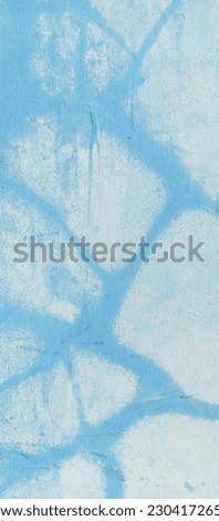 The texture of the cement wall that has been painted for the background, taken up close