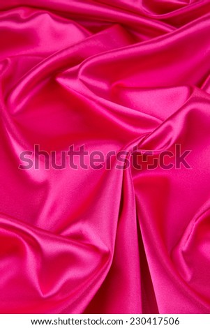 Pink silk drapery. Isolated as a whole background. 