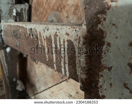 a photo of an iron frame that is rusty and unused