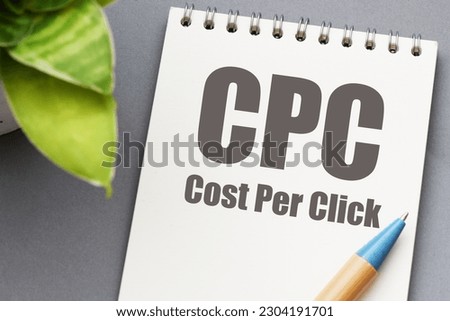 CPC - Cost Per Click words in an office notebook.