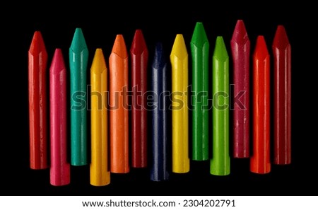 New wax pastel, colorful crayons  isolated on black 