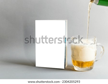 Book cover template with glass of beer, clean mock up, paste your design here Royalty-Free Stock Photo #2304205293