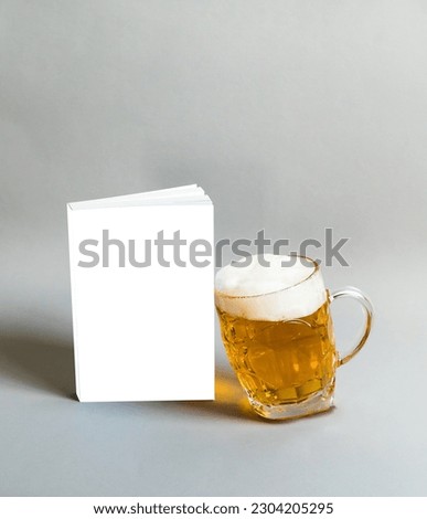 Book cover template with glass of beer, clean mock up, paste your design here Royalty-Free Stock Photo #2304205295