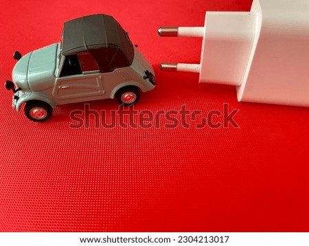 Charging for an electric car. Illustration of an electric car and a charge.