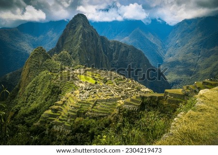 Machu picchu view on cloudy day Royalty-Free Stock Photo #2304219473